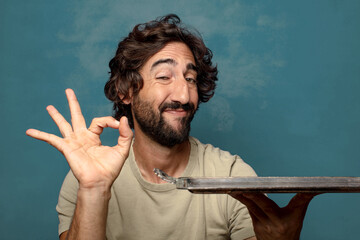 young adult bearded man with a silver tray