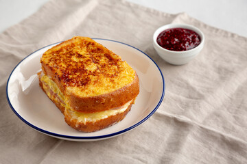 Homemade French Monte Cristo Sandwich with Raspberry Jam, side view.