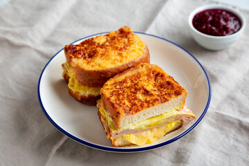 Homemade French Monte Cristo Sandwich with Raspberry Jam, side view.