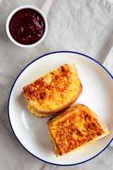 Homemade French Monte Cristo Sandwich with Raspberry Jam, Blank Notepad, top view. Flat lay, overhead.
