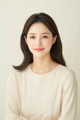 Fototapeta premium Elegant Young Woman in Soft Pastel Dress with Natural Makeup