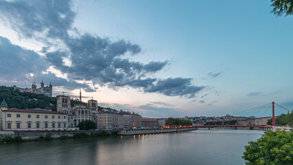 Timelapse of Saint John the Baptist Cathedral and Basilica of Notre-Dame de Fourviere in Lyon, from day to night. France
