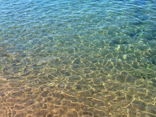 Ocean crystal clear water on sandy beach. 
