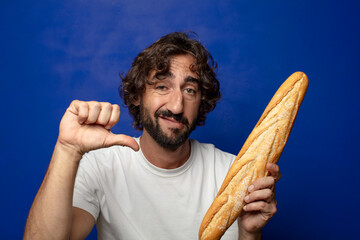 young adult bearded man with bread