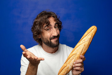 young adult bearded man with bread