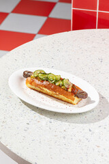 Appetizing hotdog with cucumber and jalapeno