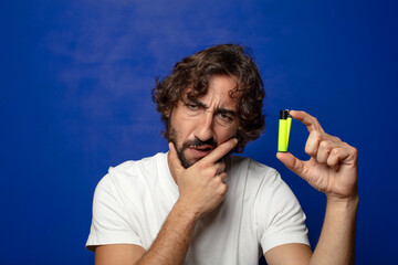 young adult bearded man with a lighter