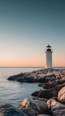A lighthouse stands on rocks at the water's edge
