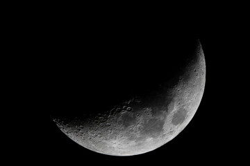 Crescent Moon Close-Up Featuring Detailed Craters in the Night Sky