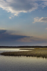 Cloudy sky with a lake in the background