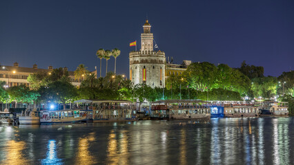 Obraz premium Torre del Oro Watchtower and Guadalquivir River Timelapse, Seville, Spain