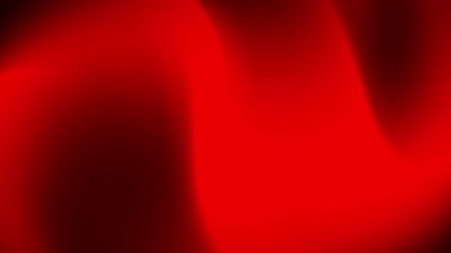 A smooth, abstract red gradient creating a dynamic and vibrant visual effect.