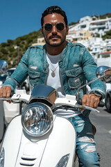Stylish Young Man Riding a Scooter on a Sunny Day in a Coastal Town