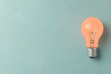 Pink Lightbulb on Minimalist Blue Background: Creative Innovation Concept