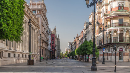 Street view of Constitucion avenue with historical buildings and trams timelapse