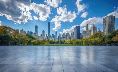 Central Park plaza with Manhattan skyline towering above the horizon on a sunny day