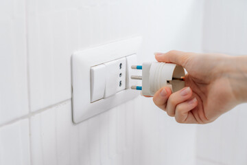 Plug Power converter or travel adapter. The electrical outlet socket in the hotel room
