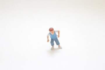 Miniature Figurine Depicting a Child With a Playful