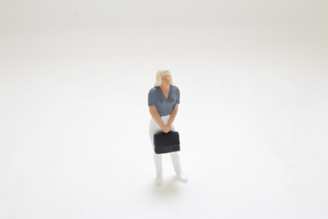 a Small Miniature Woman Figurine