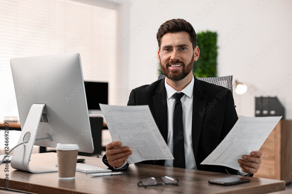 Poster man working with documents at table in office