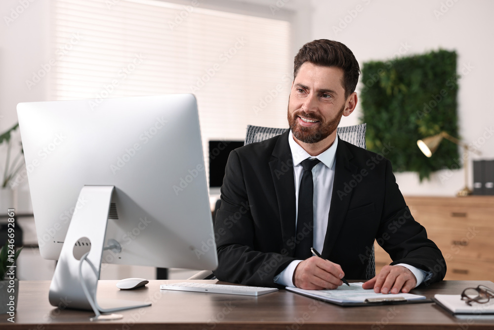 Poster man working with document at table in office
