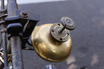 Antique ornate bronze bell for roadster bicycle. Vintage bicycle bell.