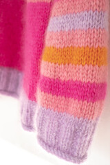 Pink and purple striped mohair and alpaca hand knitted sweater, knitted in stocking stitch and rib stitch with roll cuff. 