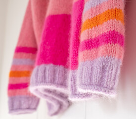Pink and purple striped mohair and alpaca hand knitted sweater, knitted in stocking stitch and rib stitch with roll cuff. 