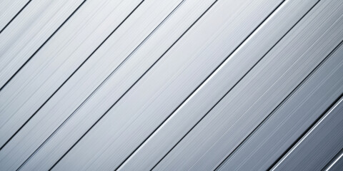 Fototapeta premium Brushed aluminum background with clean, linear textures that run diagonally. The cool metallic surface gives off a professional and high-tech feel, perfect for modern product design, website