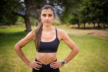 Young female athlete in black sportswear exercising outdoors in a scenic rural setting. Captured in various poses including stretching, jumping, and smiling, showcasing fitness, health, and active lif