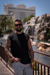 Young man sightseeing in Las Vegas and visiting the impressive hotels and casinos.