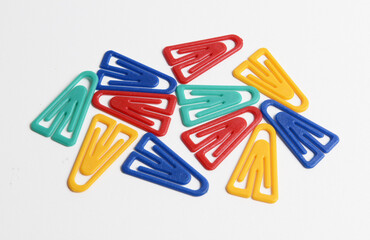 Colorful plastic paper clips, isolated on white.
