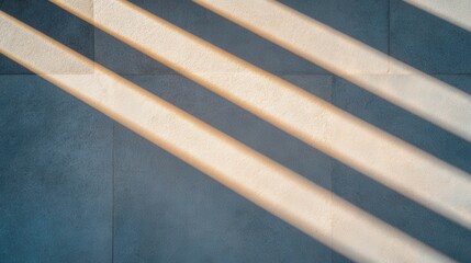Obraz premium Sunlight Stripes Creating Patterns on a Smooth Textured Wall Surface in Daylight