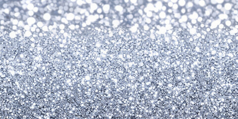 A silver and lavender glitter fusion background, with a blend of cool metallic sparkles. This elegant design is ideal for winter-themed products, luxury event invitations, or dreamy, ethereal branding