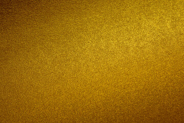 Shimmering golden texture is creating an elegant and luxurious background with selective focus.