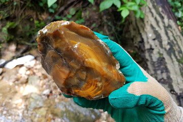 Unworked fragment of flint nodule with concentric-zonal pattern, field photo