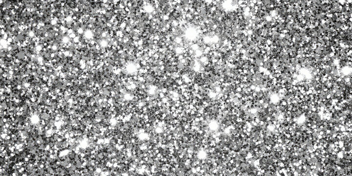 A sparkling silver glitter backdrop with large and small glitter specks dancing in the light. The shimmering texture adds a luxurious and glamorous touch, ideal for party decorations, fashion