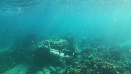 under water young woman snorkeling on tailand