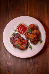 Beautiful restaurant dish golden potatoes and juicy meat, beautiful food photo