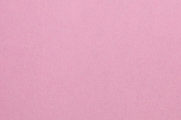 A pink background with a white object in the middle, textured origami paper backdrop