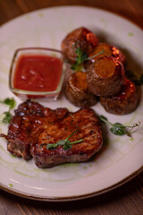 Beautiful restaurant dish golden potatoes and juicy meat, beautiful food photo