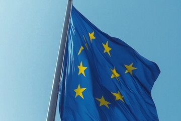 European Union flag flying high in sky, symbolizing unity and shared values of member countries.