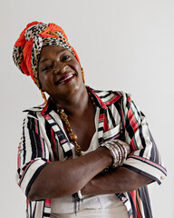 Beautiful woman in African clothes happy on a white background. Smiling, serious. Rio de Janeiro,...