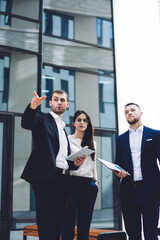 Business people discussing business issue while standing outside office