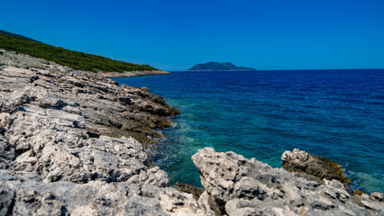 view over rocky Albania coast in the far distance.