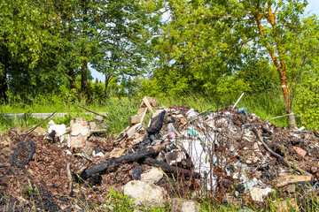 Illegal garbage dump on the side of the road in the countryside, Kaluga region, Russia