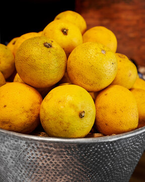 Close-Up of Fresh Puerto Rican Oranges in a Textured Basket