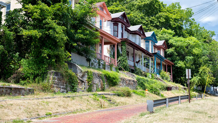 Vintage timber townhouses with paved sidewalk in Cumberland, Moreland.