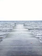 Fototapeta premium wooden deck entering the sea
