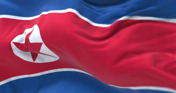 Close-up of North Korea national flag waving in the wind